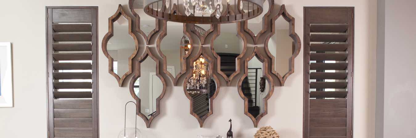 White Polywood shutters on a window in a trendy teen bedroom.