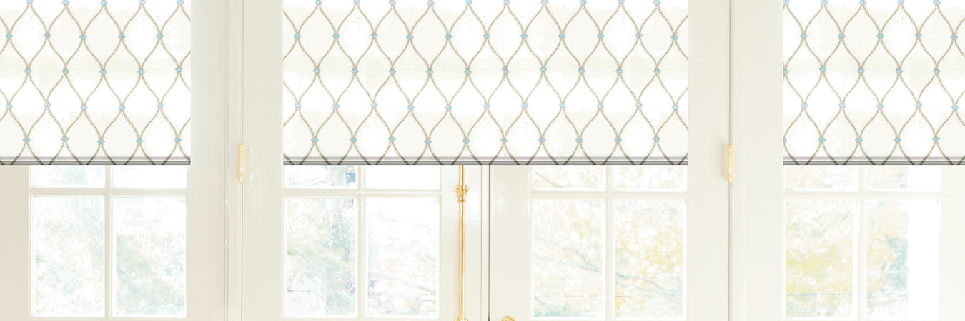 White Roman shades in a dining room.